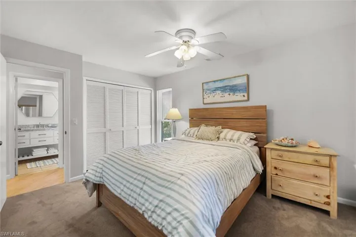 Bedroom featuring a closet, carpet, and a ceiling fan