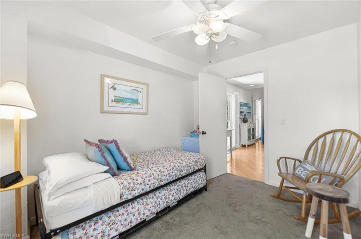 Bedroom with carpet floors and a ceiling fan