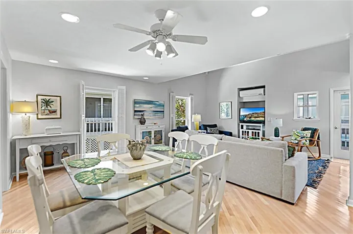 Dining area featuring ceiling fan, light wood-style flooring, and recessed lighting