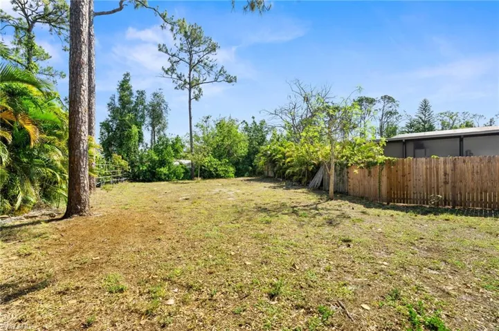 View of yard featuring fence