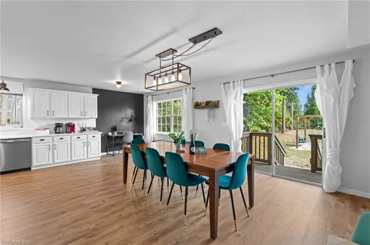 Dining area with light wood finished floors and baseboards