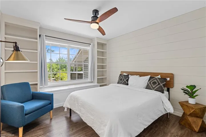 Bedroom featuring wood finished floors and ceiling fan