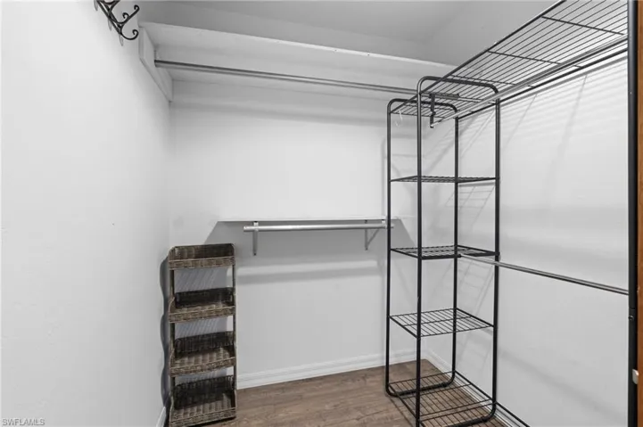 Spacious closet with wood finished floors