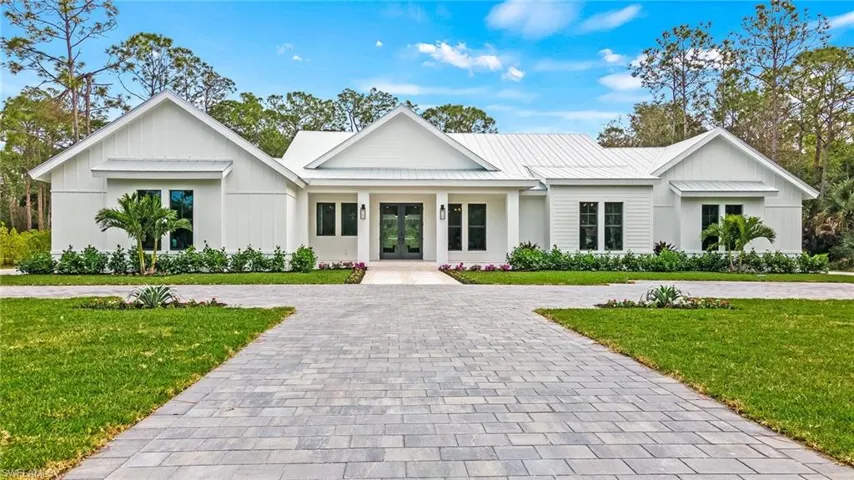 Modern farmhouse featuring a beautiful front lawn