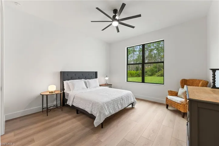 Bedroom featuring light wood-type flooring and ceiling fan