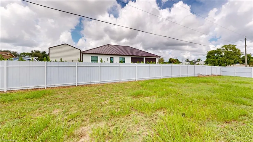 View of yard and new fence