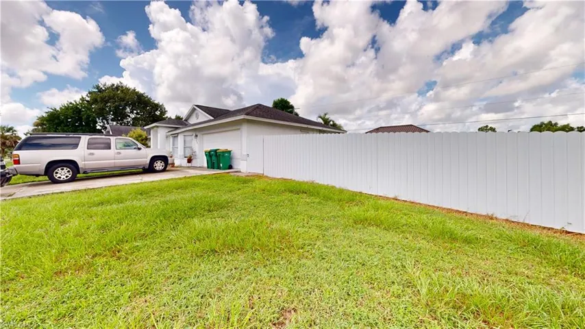 View of yard with a garage