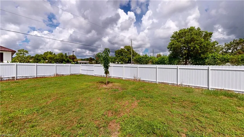 View of yard and new fence