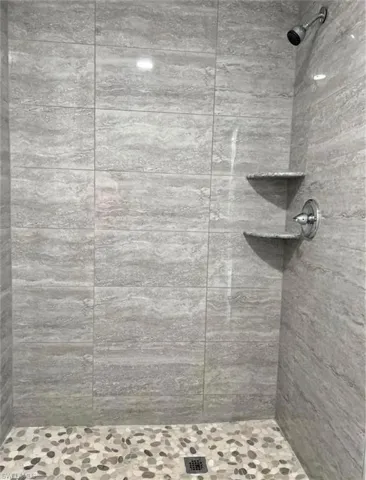 Efficiency bathroom with tiled shower