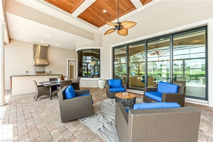 View of patio / terrace featuring outdoor dining area, ceiling fan, and an outdoor living space