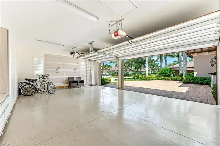 Garage featuring a garage door opener