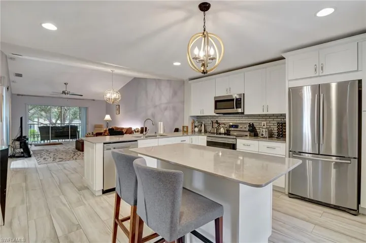 Kitchen with Island, Porcelain tile throughout Kitchen, Dining area and Great room