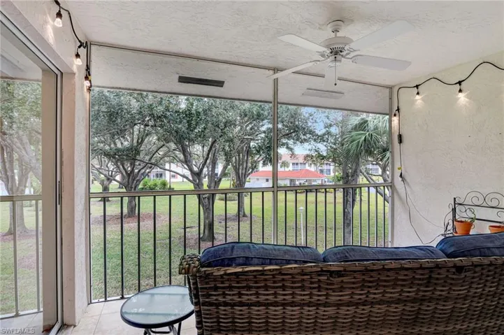 Sunroom /screened lanai with view of community and community Pools