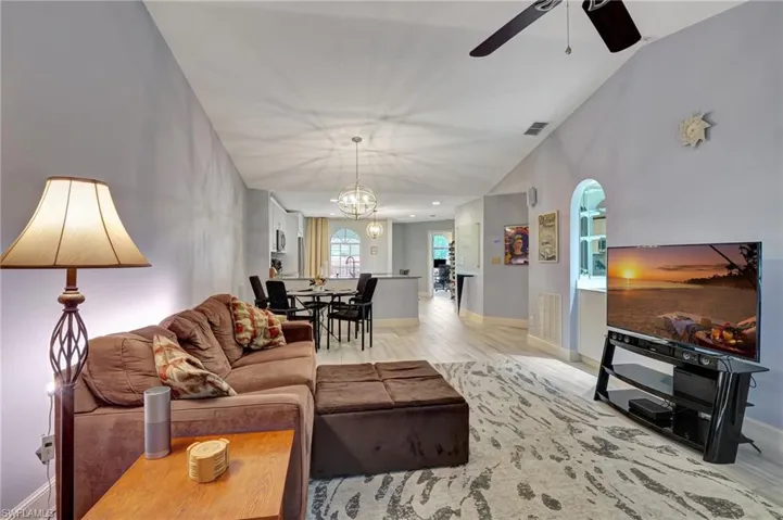 Great room featuring vaulted ceiling, and ceiling fan