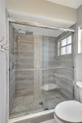 Bathroom walk in shower, and tile floor