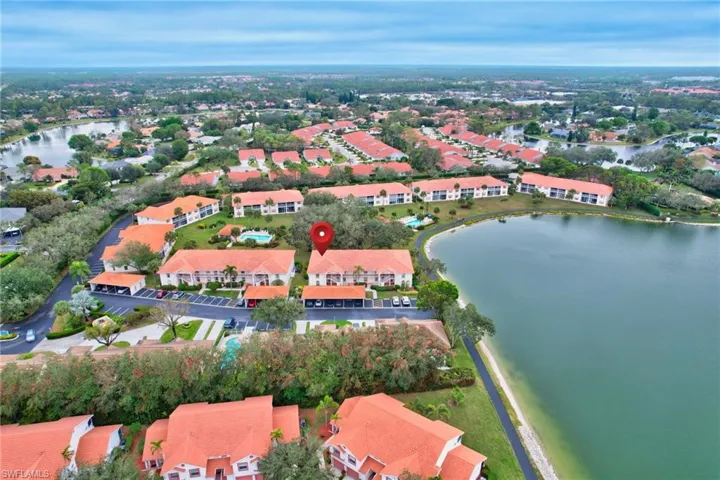 Aerial view of Community with walking path around the lake