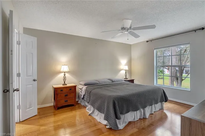 Bedroom with Pergo flooring and ensuite bathroom