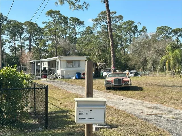 View of front of property with a front yard