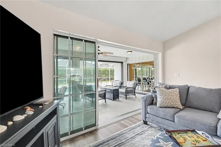 Front living room - Sliding glass door does open to pocket into the wall and open more