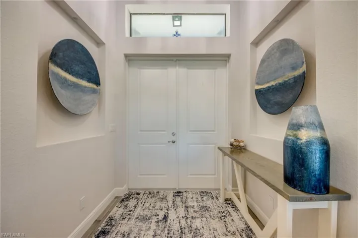 Foyer featuring baseboards