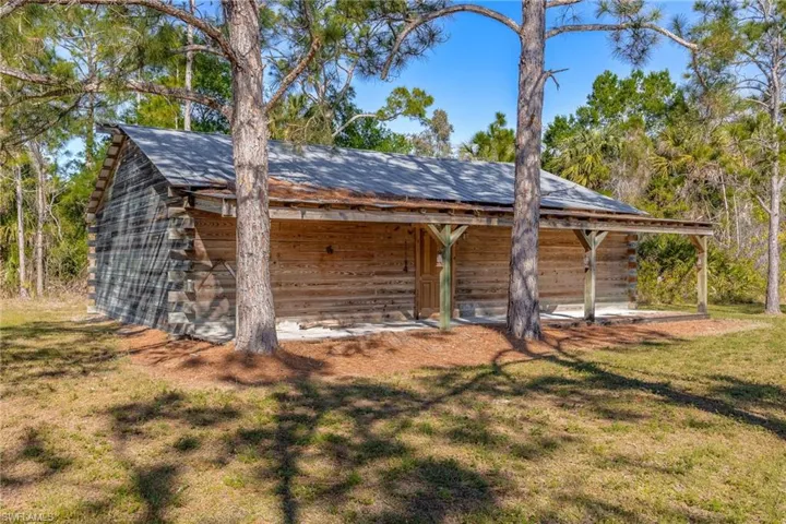 View of outbuilding with an outdoor structure