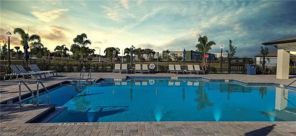 Community pool with a patio