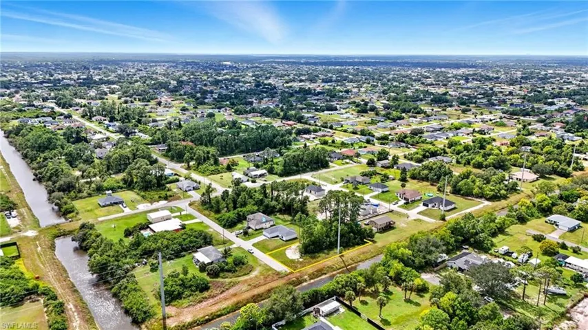 Aerial overview of property's location featuring nearby suburban area