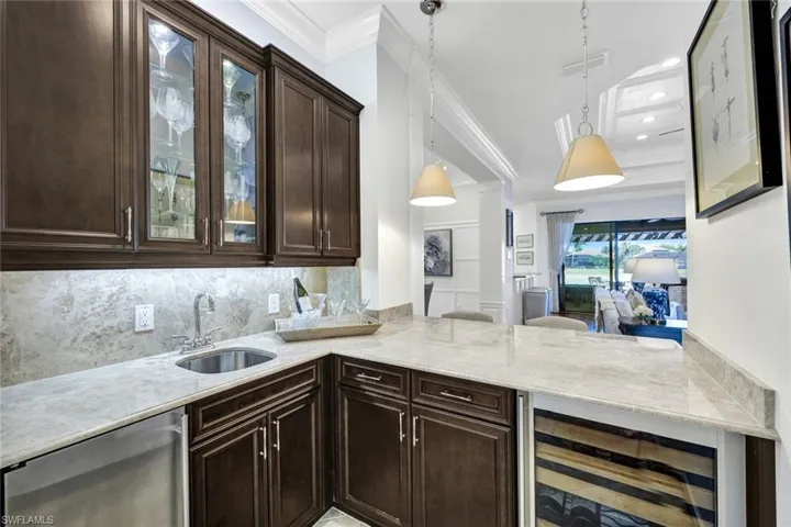 Wet bar featuring, wine cooler and built-in ice maker