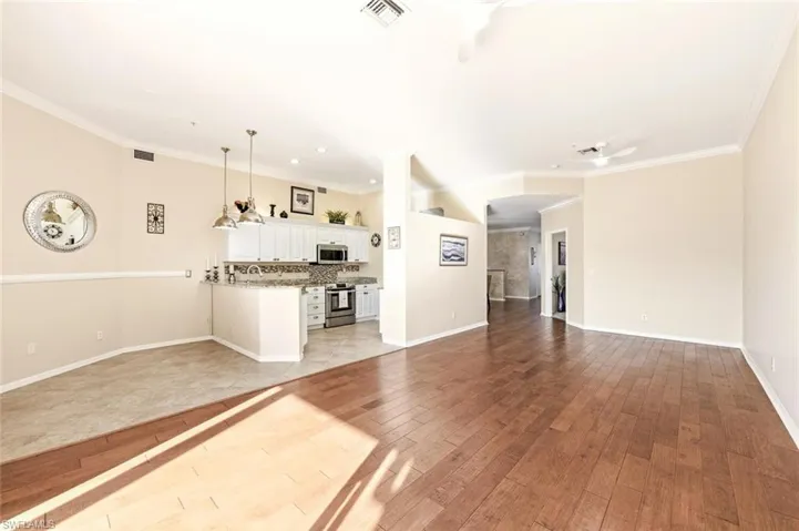 Open floor plan for entertaining. Extended area beyond counter can fit table or bar stools.