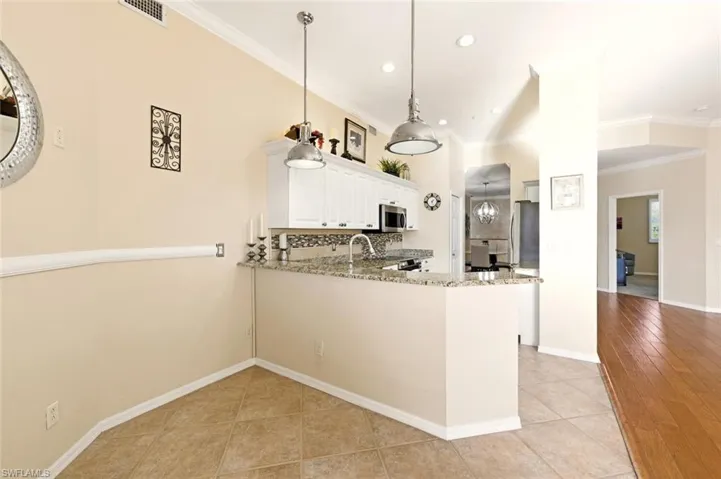 Stainless appliances, granite, and well appointed fixtures
