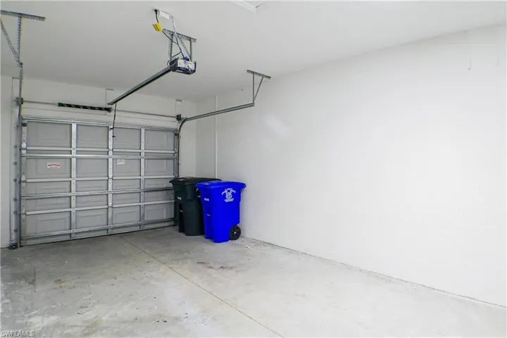 Garage featuring a garage door opener