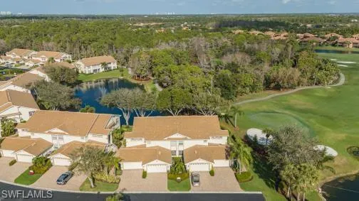 Aerial perspective of suburban area with a nearby body of water