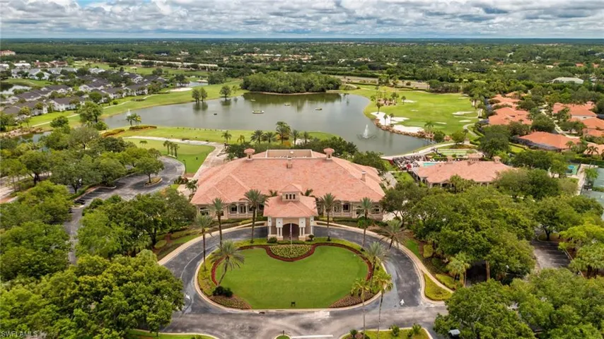 Aerial view of residential area with a large body of water and a local golf course