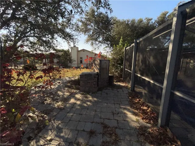 View of patio / terrace featuring built-in fire pit
