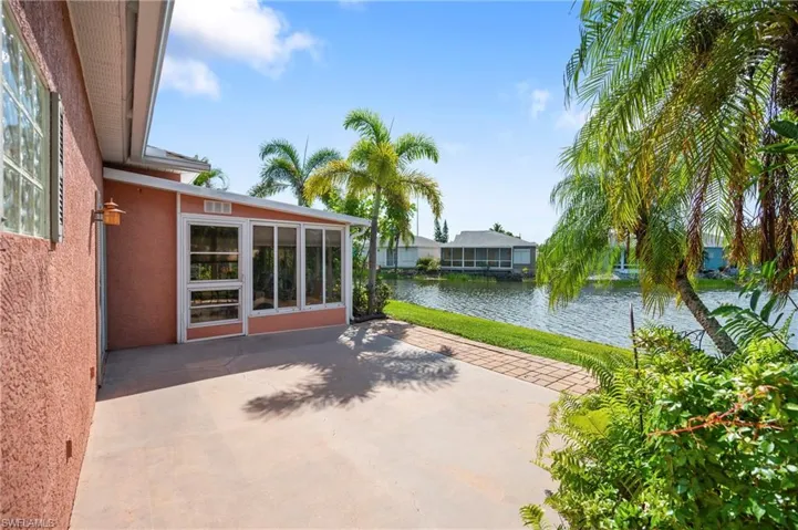View of patio with a water view