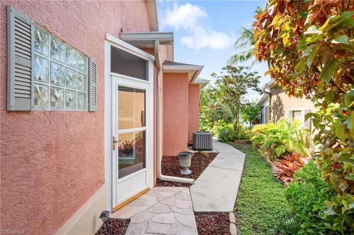 View of exterior entry with stucco siding