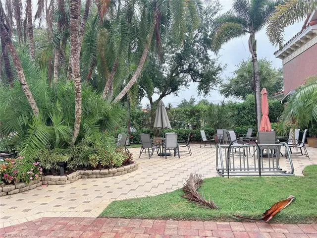 View of community 'a amenity with a patio area and grill