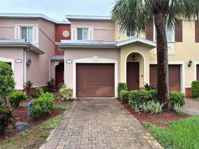 View of front facade featuring a garage