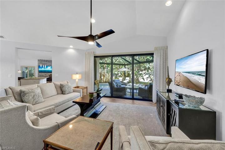 You will love to entertain in this open and airy living room. VAULTED CEILINGS THROUGHOUT THE HOME!