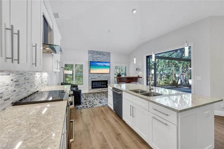 You will LOVE this beautiful kitchen with stainless appliances, shaker cabinets, quartz countertops, and plenty of storage space.