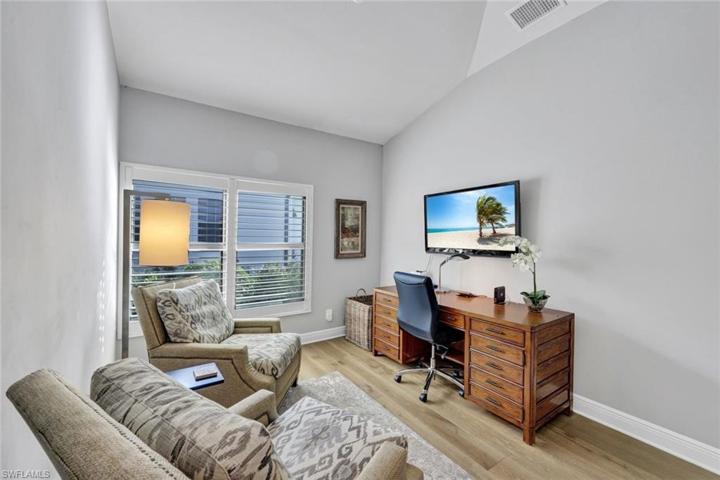 Den is located next to the primary suite, currently being utilized as an office.