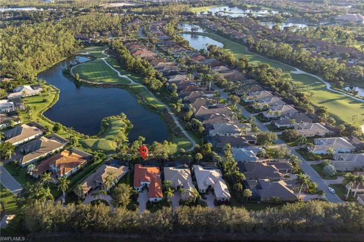 Aerial overview of property's location with a nearby body of water, a local golf course, and nearby suburban area