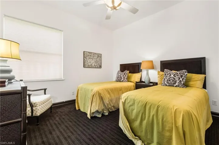 Bedroom with carpet and ceiling fan