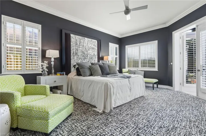Carpeted bedroom with access to exterior, crown molding, and a ceiling fan