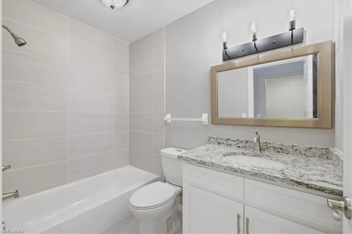 Full bathroom featuring vanity and shower / tub combination