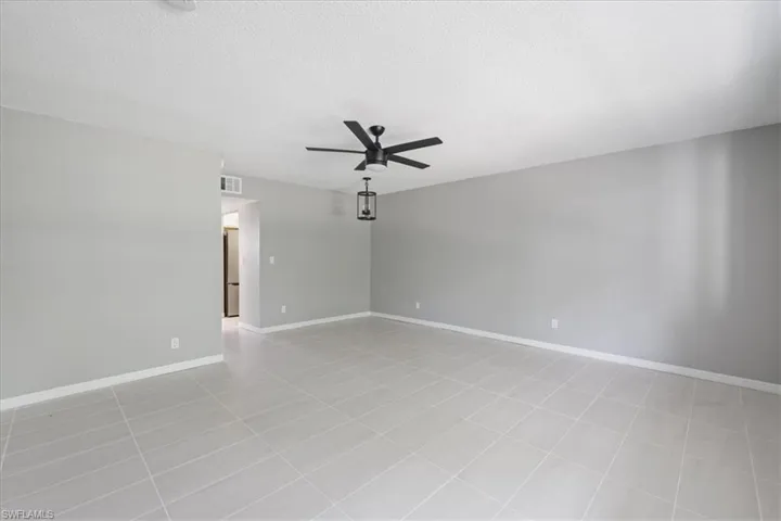 Spare room featuring a textured ceiling and a ceiling fan