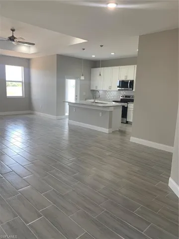 open floor plan with coffer ceilings
