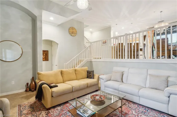 Living room featuring crown molding
