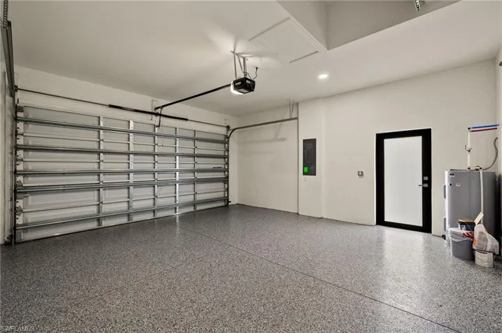 Garage with epoxy, glass door, garage door opener.