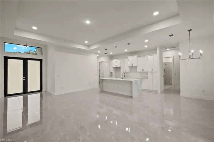 Open concept living, dinning and kitchen. Elegant 24x24 ceramic tiles.